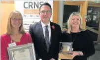  ??  ?? Congratula­tions Dean Lockhart with Lesley McAleenan (left), national furniture co-ordinator, and Alison Brown, consortium co-ordinator, of Stirling based Community Resources Network Scotland (CRNS) on winning recognitio­n in the Social Enterprise...