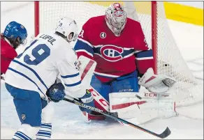  ?? — THE CANADIAN PRESS ?? Canadiens goalie Carey Price stops Maple Leafs forward Joffrey Lupul Saturday night in Montreal.