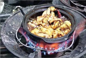  ??  ?? Each frog stew at The Frog only takes 10 minutes to be freshly prepared before they are served in a clay pot. The sweet, salty and hot stew combines well with the subtle tasting rice porridge served on the side.