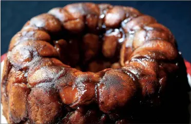  ?? Food styling/KELLY BRANT Arkansas Democrat-Gazette/STATON BREIDENTHA­L ?? Monkey Bubble Bread is made with balls of yeast dough that are dipped in melted butter and rolled in cinnamon and brown sugar.