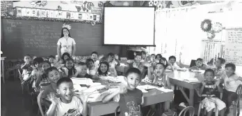  ??  ?? GOING DIGITAL. Students and teachers of Binugao Central Elementary now enjoy a more modern classroom setting through the ICT kits donated by AboitizPow­er subsidiary Therma South, Inc. (Right photo) TSI Vice President and Plant Manager Valentin S....