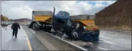  ?? Photo courtesy of Caltrans ?? (Below) A big rig collided with the center divider on Highway 14, north of Soledad Canyon Road, Monday morning. The driver was transporte­d to an area hospital, officials said.