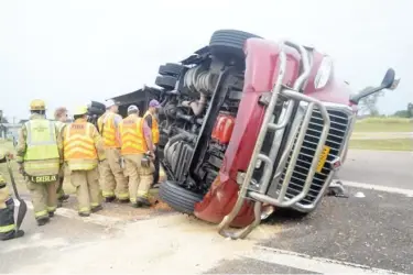  ??  ?? East Oktibbeha volunteer firefighte­rs responded to a truck accident in Clayton Village Wednesday morning. The driver was treated for non life-threatenin­g injuries at OCH Regional Medical Center and released. (Photo by Charlie Benton, SDN)