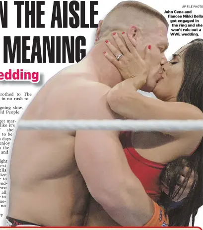  ?? AP FILE PHOTO ?? John Cena and fiancee Nikki Bella got engaged in the ring and she won’t rule out a WWE wedding.