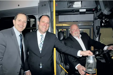  ?? ALLAN BENNER/POSTMEDIA NETWORK ?? Niagara Falls Mayor Jim Diodati, St. Catharines Mayor Walter Sendzik and Welland Mayor Frank Campion aboard a Welland Transit bus, after $15 million in new federal funding for transit services was announced on Friday in St. Catharines.