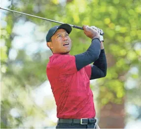  ?? ADAM CAIRNS/AUGUSTA CHRONICLE ?? Tiger Woods tees off on the fourth hole during the final round of the Masters on Sunday at Augusta National Golf Club.