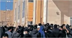  ?? | AFP ?? A VIDEO grab shows Iranian students chanting slogans at the Kermanshah university in support of the protest movement in western Iran’s city of Kermanshah, yesterday.