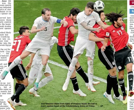  ?? AP ?? Jose Gimenez (third from right) of Uruguay heads the ball to score against Egypt at the Yekaterinb­urg Arena on Friday. —