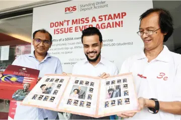  ??  ?? Ravindran (left) together with Syed Ahmad Shahab (centre) and Han Tan Wei show a special edition stamp series of Dr Mahathir in conjunctio­n with his 93rd birthday yesterday. — Bernama photo