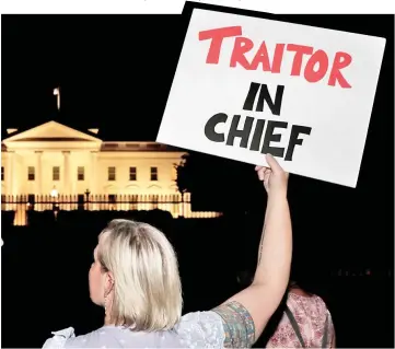  ?? — Reuters photo ?? Protesters rally outside the White House in Washington after Trump’s return from Helsinki, Finland.