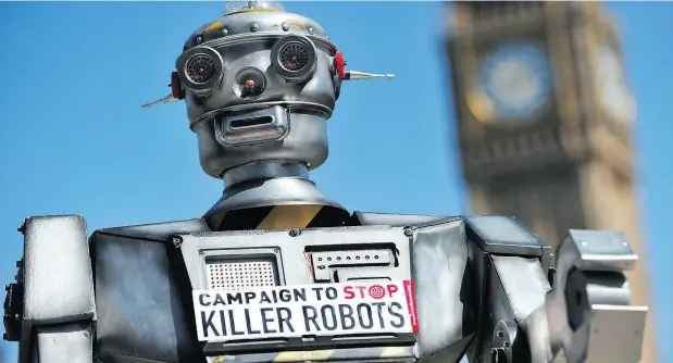  ?? CARL COURT / AFP / GETTY IMAGES FILES ?? A file photo shows a mock “killer robot” in central London during the launching of the Campaign to Stop “Killer Robots.”