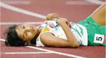  ??  ?? Runner OP Jaisha, 33, told media she collapsed after the women’s marathon because Indian officials failed to provide refreshmen­ts at designated country stations during the race.