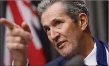  ?? The Canadian Press ?? Manitoba Premier Brian Pallister speaks to media at an press conference at the Manitoba Legislatur­e in Winnipeg. Pallister is taking criticism for making comments about the physical appearance of the woman who chairs the Winnipeg Chamber of Commerce.