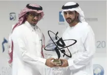  ?? Christophe­r Pike / The National ?? Sheikh Hamdan bin Mohammed, Crown Prince of Dubai, presents Badeer Al Asaker, secretary general of the Risk Foundation, with the Mohammed bin Rashid Al Maktoum Knowledge Award yesterday