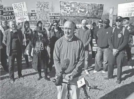  ?? ?? UAW President Shawn Fain speaks in Chattanoog­a, Tenn., on Dec. 18. Fain visited the Volkswagen plant with a group including workers and community and faith leaders. The group delivered a letter to VW, “demanding the company end its union-busting and intimidati­on.”