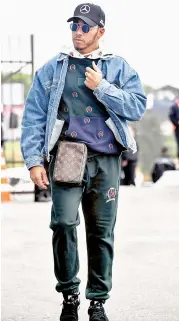  ?? — AFP ?? Mercedes’ Lewis Hamilton arrives at the Interlagos racetrack in Sao Paulo, Brazil, on Thursday, ahead of the Brazil Grand Prix.