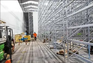  ?? Nate Guidry/Post-Gazette photos ?? Rows of plant stack racks fill one of the rooms inside the new 60,000-square-foot Fifth Season building in Braddock on Monday. The company uses high-tech tools like robots and artificial intelligen­ce to grow everything from lettuce to herbs.