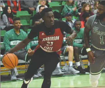 ?? Submitted photo ?? EYES UP: Henderson State senior forward Brad Nairn (23), of Nassau, Bahamas, looks to pass as Arkansas-Monticello senior guard Stephon Gordon adds pressure. The Reddies fell, 82-72, in the road game.