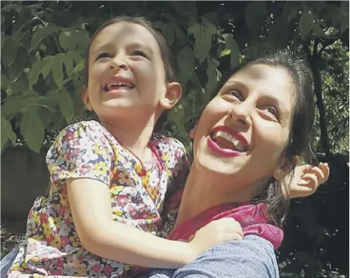  ??  ?? Nazanin Zaghari-ratcliffe embraces her daughter Gabriella in Damavand, Iran following her release from prison for three days.