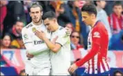  ?? AFP ?? Bale’s (left) provocativ­e celebratio­n came in the Madrid derby.