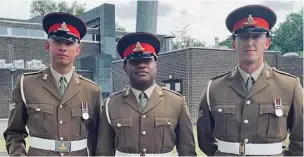  ??  ?? Private Sailasa Laudola with two of his colleagues in the British Army.