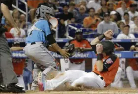  ?? LYNNE SLADKY — ASSOCIATED PRESS ?? U.S. Team’s Chance Sisco, right, beats the throw to World Team catcher Francisco Mejia of the Indains to score during the second inning of the All-Star Futures game July 10.