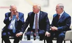  ??  ?? Left: Trump sitting between Israeli Prime Minister Benjamin Netanyahu (right) and Israeli President Reuven Rivlin during a welcome ceremony upon his arrival in Tel Aviv yesterday.