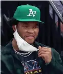  ?? MARK J. REBILAS/USA TODAY SPORTS ?? Cardinals quarterbac­k Kyler Murray wears an Oakland Athletics hat during the Suns-Warriors game on March 4.