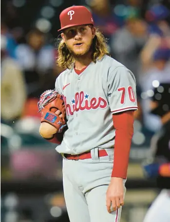  ?? FRANK FRANKLIN II/AP ?? Philadelph­ia Phillies’ pitcher Bailey Falter reacts as Pete Alonso runs the bases after hitting a two-run home run during the third inning Friday in New York.