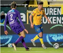  ?? GETTY IMAGES ?? Liberato Cacace, right, has been a regular starter for Belgian Pro League club Sint-Truiden after making the move to Europe.