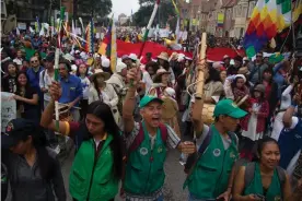  ??  ?? Protesters in Bogotá on Thursday. Thousands of people thronged the city’s historic Plaza de Simón Bolívar, singing the national anthem. Photograph: Anadolu/Getty Images