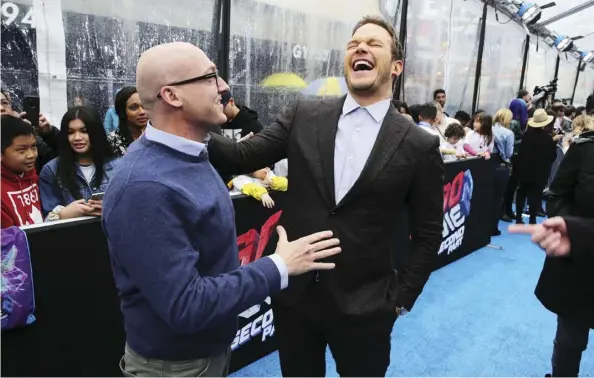  ?? Getty ImaGes ?? The Lego Movie 2: The Second Part co-director Mike Mitchell, left, seen with star Chris Pratt, says the movie required twice the directing.