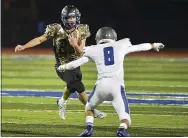  ?? PETE BANNAN — MEDIANEWS GROUP ?? Kennett running back Julian Sparacino looks to avoid Great Valley’s Storm Johnson in the first quarter Friday night.