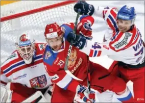  ?? PAVEL GOLOVKIN — THE ASSOCIATED PRESS FILE ?? In this file photo, Russia’s Ilya Kovalchuk, center, tries to score as Czech Republic’s Ondrej Vitasek, right, and Dominik Furch make a challenge during the Ice Hockey Channel One Cup match in Moscow. Russia is considered the favorite for gold in the...