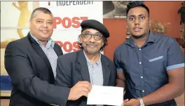  ??  ?? Krisendra Bisetty, acting editor, left, and Nanda Soobben, chief executive of CFAD, congratula­te Keenan Naidu on winning a bursary to study at the Centre for Fine Arts, Animation &amp; Design