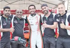  ?? ?? ±
Mansoor Al Mansoori (centre) of Team Abu Dhabi poses with the team-mates after the race.