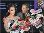  ?? ?? ALL EYES ON HER
CoCo Lee and her husband, Bruce Rockowitz, talk to the media at their 2011 wedding banquet.