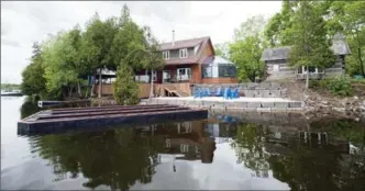  ?? ADAM GAGNON, SPECIAL TO THE RECORD ?? Lakeside view of 32 Lakeside Dr., Puslinch. This home is one of five you can tour on June 24 by lake or by land. This tour is a fundraiser to help with the costs of dredging the lake.