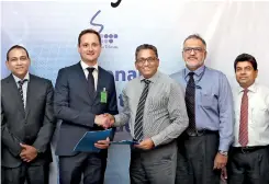  ??  ?? From left: datawerks Gmbh Consultant Raj Thangiah with datawerks Gmbh Chief Technology Officer Tony Andris exchanging the agreement with SLT Chief Commercial Officer Kiththi Perera, alongside SLT Enterprise Solution GM M.I. Deen and SLT Enterprise and...