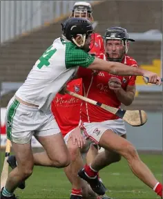  ??  ?? Kevin Rowe of Fethard winces as Shane Murphy challenges.