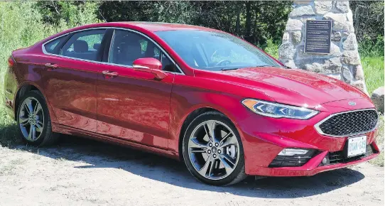  ?? JIL MCINTOSH ?? The 2018 Ford Fusion Sport has subtle sporty styling cues, including a black grille, larger air intakes, rear spoiler and quad exhaust tips.