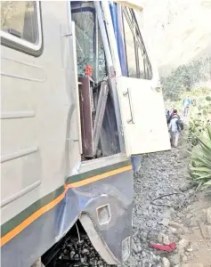  ?? — Reuters photo ?? The damaged side of a train is pictured after it crashed with another train near Machu Picchu in Peru, in this picture obtained from social media.