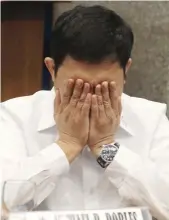  ?? (Camille Ante) ?? SENATE HOT SEAT – Former Bureau of Immigratio­n associate commission­er Atty. Michael Robles tries to stay calm and composed while being grilled during the Senate Blue Ribbon Committee hearing on the Jack Lam bribery scandal.