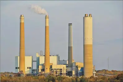  ?? AP photo ?? AES Indiana Petersburg Generating Station, a coal-fired power plant, operates in Petersburg, Ind. on Oct. 25.