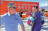  ?? DAILY; ZHANG GUANGYU / FOR CHINA DAILY ?? From left: The D ramp constructi­on area of Zhoushan-Daishan Bridge of Zhejiang Transporta­tion Group. The steel box girder is successful­ly hoisted, Oct 28, 2020. YAO FENG / FOR CHINA
Uyghur dancers dressed in festive costumes at the opening ceremony of the Wutong-Daquan-Mulei section of the Beijing-Xinjiang Expressway, June 30. CAI ZENGLE / FOR CHINA DAILY; Workers on the eighth section of Duyun- Shangri-La Expressway in Suoshan town, Ludian county, Zhaotong city, Yunnan province, June 21.