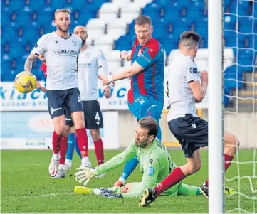  ??  ?? Dee keeper Adam Legzdins pulls off a fine save from Caley Jags’ Shane Sutherland.