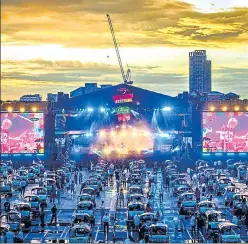  ?? AFP ?? Music fans attend a live show from traditiona­l taxi cars called tuk-tuk in Bangkok as Thailand has started n
to allow the hosting of outdoor concerts with social distancing measures in place.
Agencies