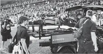  ?? COLE BURSTON
THE CANADIAN PRESS ?? Argonauts quarterbac­k Ricky Ray is taken off the field with an injury during second-half CFL action against the Calgary Stampeders at BMO Field in Toronto. Calgary won the game, 41-7.