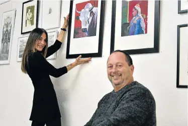  ?? Picture: EUGENE COETZEE ?? WELL-LOVED PIECES: Michal and Kevin Abraham with two works by artist Greg Kerr (‘Lobola Bull’ and ‘Bosso and Empress’) that are among the couple’s artworks that are going on auction