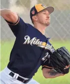  ?? ROY DABNER / MILWAUKEE JOURNAL SENTINEL ?? Brewers pitcher Zach Davies throws in the bullpen.